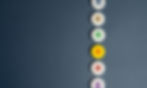 Close-up of colorful gift icons arranged in a vertical line on a dark background.