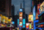 Illuminated billboards and advertisements in Times Square, New York City at night.