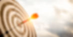 An image of a target with a dart in the middle point