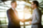 Two employees shaking hands