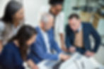 a diverse team in an office setting of different ages and genders and ethnicitiesa diverse team in an office setting of different ages and genders and ethnicities