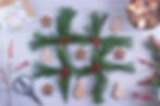Christmas tic-tac-toe made from Christmas tree branches and gingerbread cookies