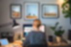 A woman working from her at-home office desk