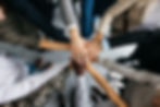 Overhead view of a diverse team stacking hands in a gesture of unity and teamwork