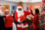 Santa play a Christmas game at the office