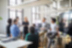 A team in an office listening to the team leader
