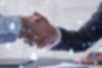 Handshake between two professionals with digital network overlay symbolizing business connections.