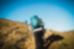 Team members hiking with their adventure bags at hand