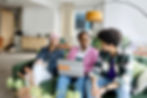 Employees sitting together on a sofa in a positive work environment