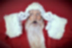 Santa holding onto his glasses excited about gift cards for Christmas