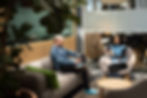 Two GoGift employees sitting at the office and chatting