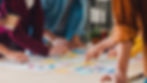 A team having a brainstorming session on a desk