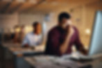 Employees working in the office late at night
