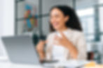 A woman having a video call while smiling and making hand gestures