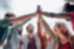 Colleagues high-fiving each other and being team players