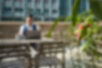 Employees working in different locations outside a traditional office setting