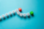 Row of white dice with directional arrows showing a change in direction.