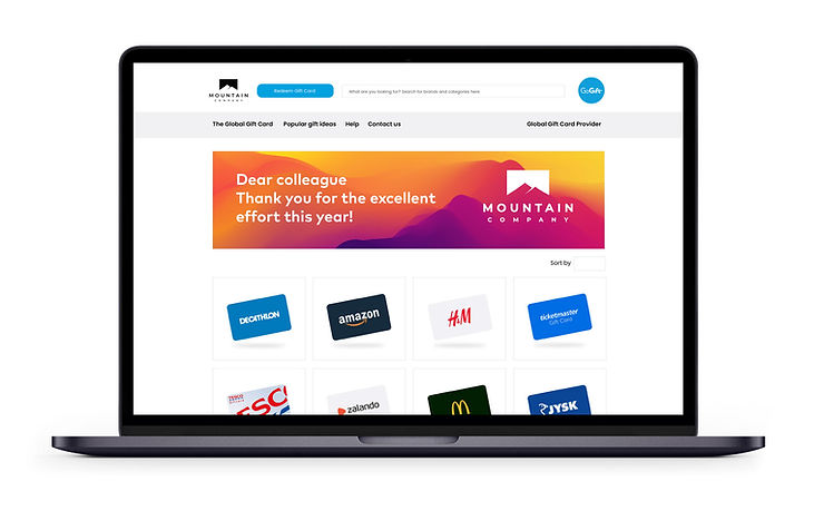 Laptop screen displaying a "MOUNTAIN COMPANY" gift card web page with a thank you message to a colleague and a variety of brand gift card options below.