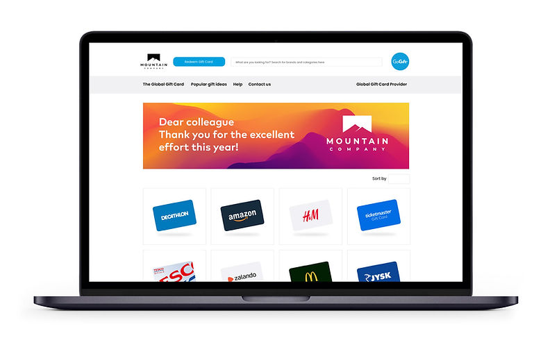 Laptop screen displaying a "MOUNTAIN COMPANY" gift card web page with a thank you message to a colleague and a variety of brand gift card options below.