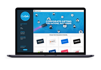 A laptop screen displaying the homepage of "GoGift" with an option for corporate gifting featuring a variety of brand gift cards.