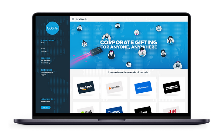 Laptop screen showing a corporate gifting web page with a slogan "CORPORATE GIFTING FOR ANYONE, ANYWHERE" and a selection of gift card options from various brands, part of the "GoGift" service platform.